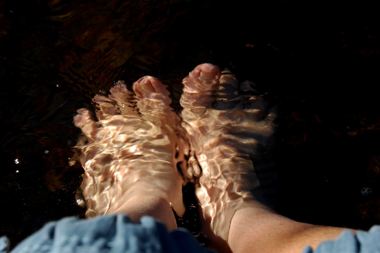 Feet in flowing water